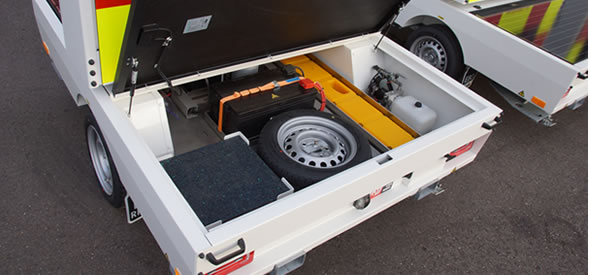 Handy storage compartment to store the portable rumble stripes, cones and spare wheel